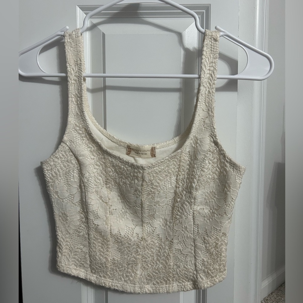 Cropped Altar’d State tank top.